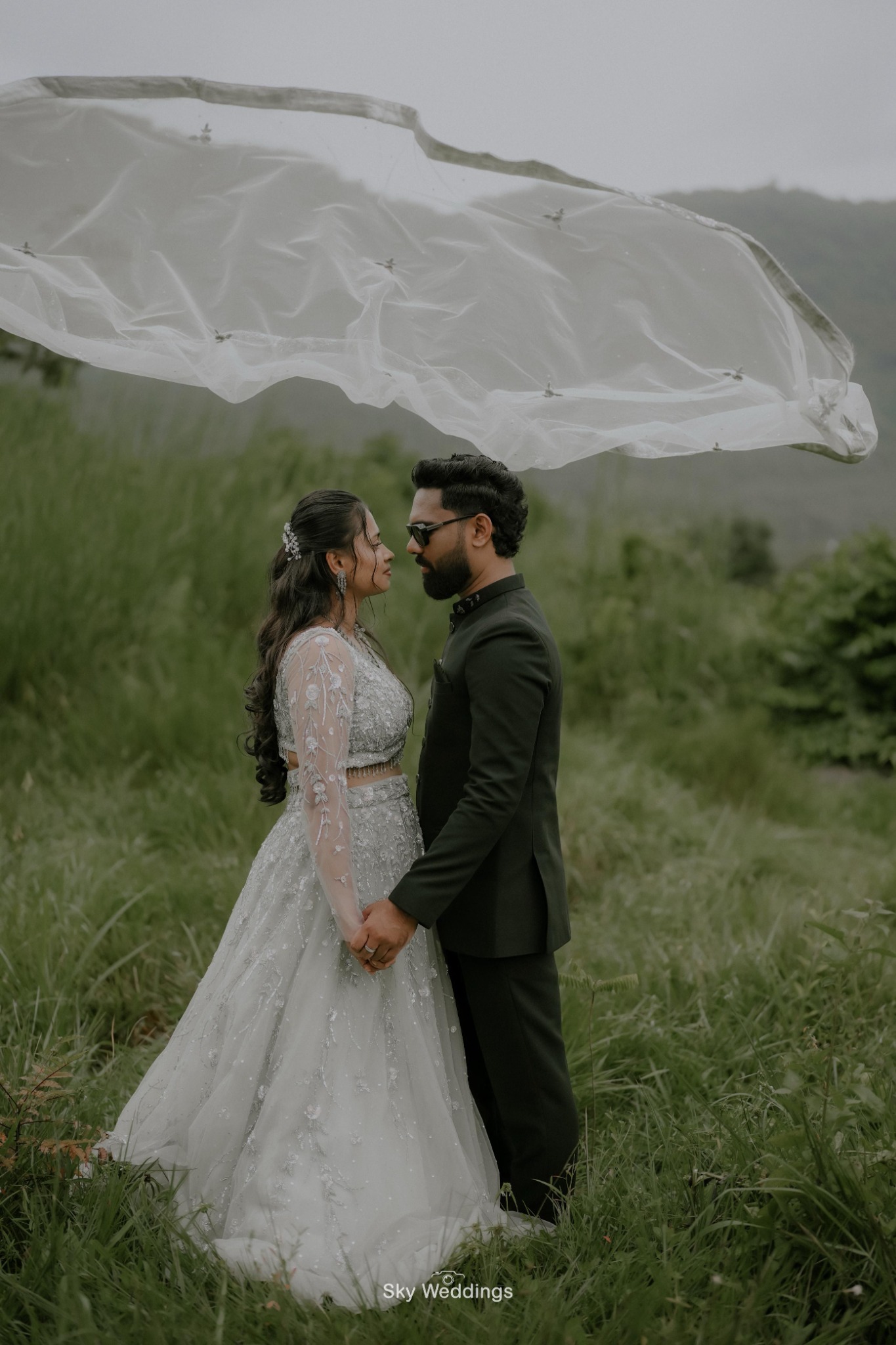 A magical moment beneath a flowing veil